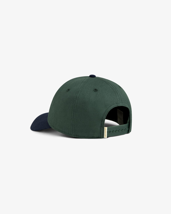Colorblock Club Hat in green with a dark blue brim, back view, showing adjustable strap.