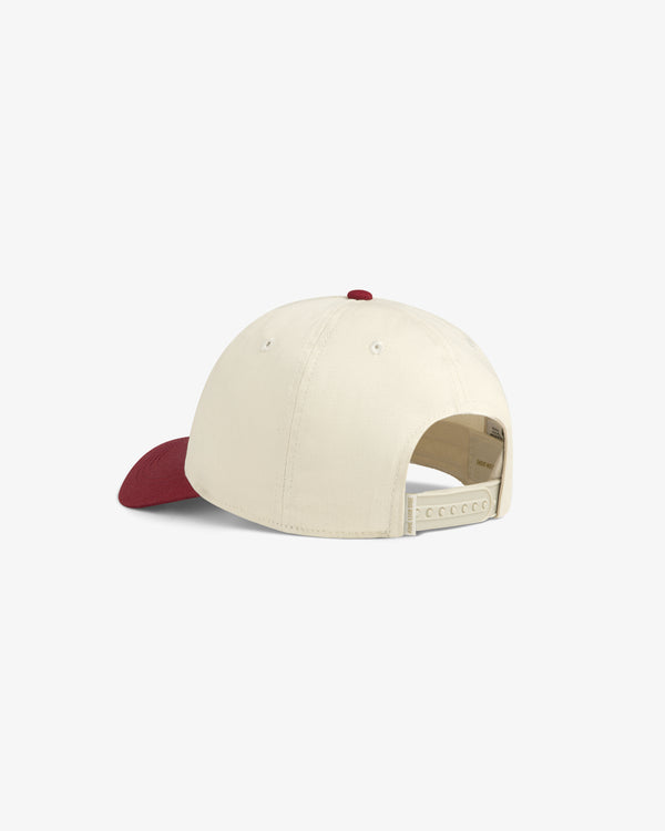 Colorblock Club Hat: cream cap with red brim, back view shows adjustable snap closure.