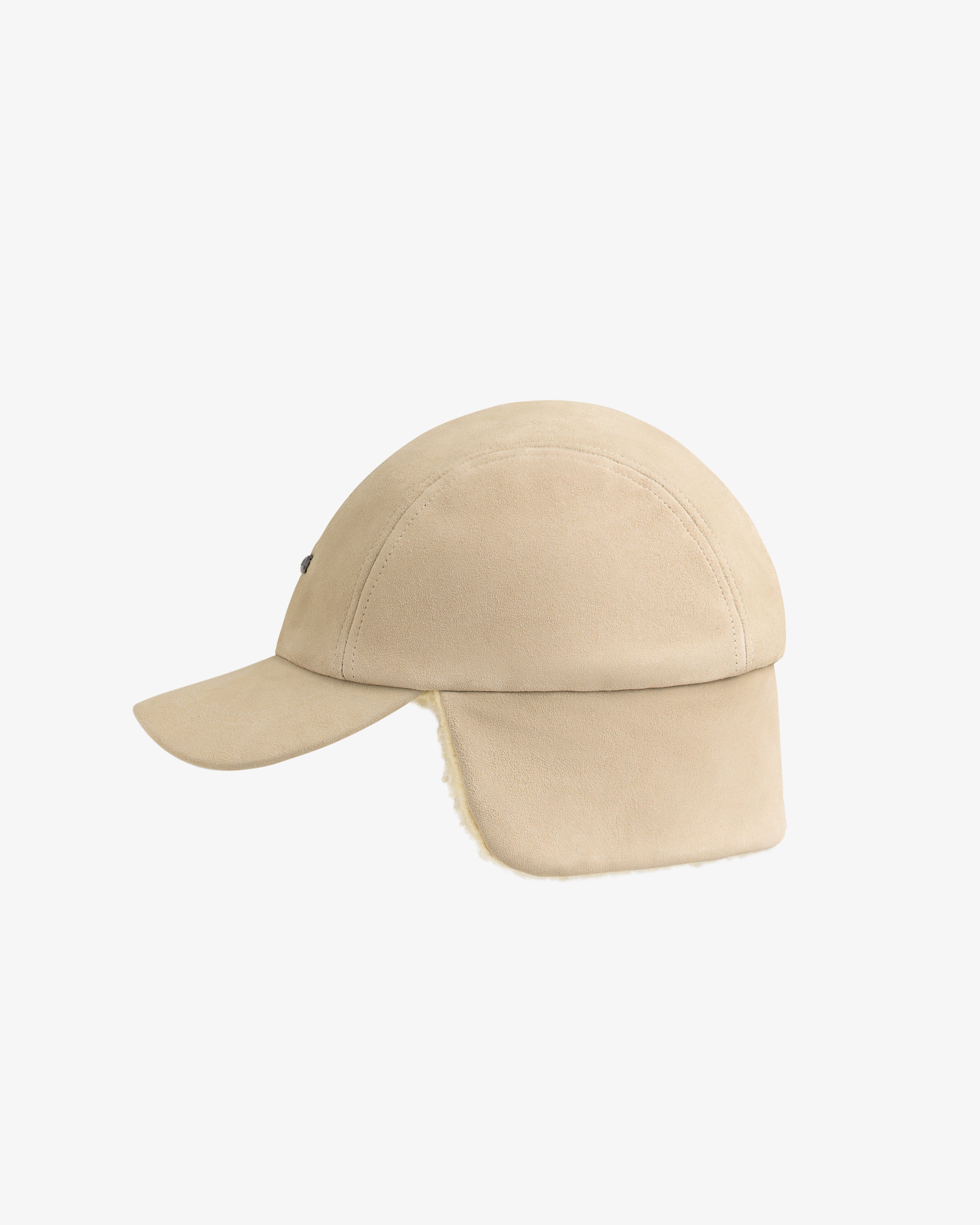 Beige Shearling Earflap Hat with fold-down earflaps lined with light-colored fleece.