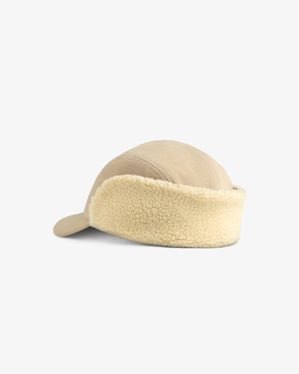 Beige Shearling Earflap Hat featuring textured fleece earflaps.