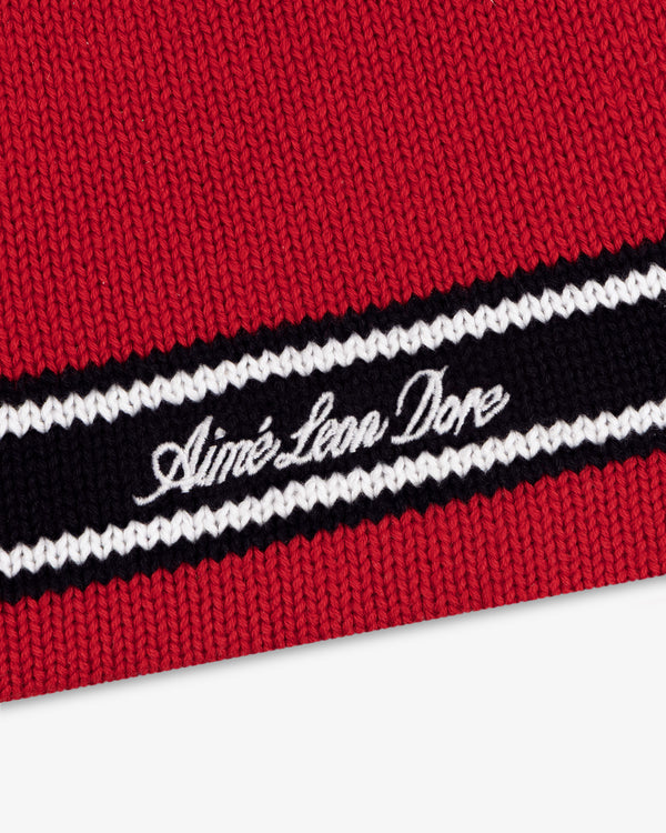 Stripe Knit Beanie in red with black and white stripes, Aimé Leon Dore embroidered in white cursive.