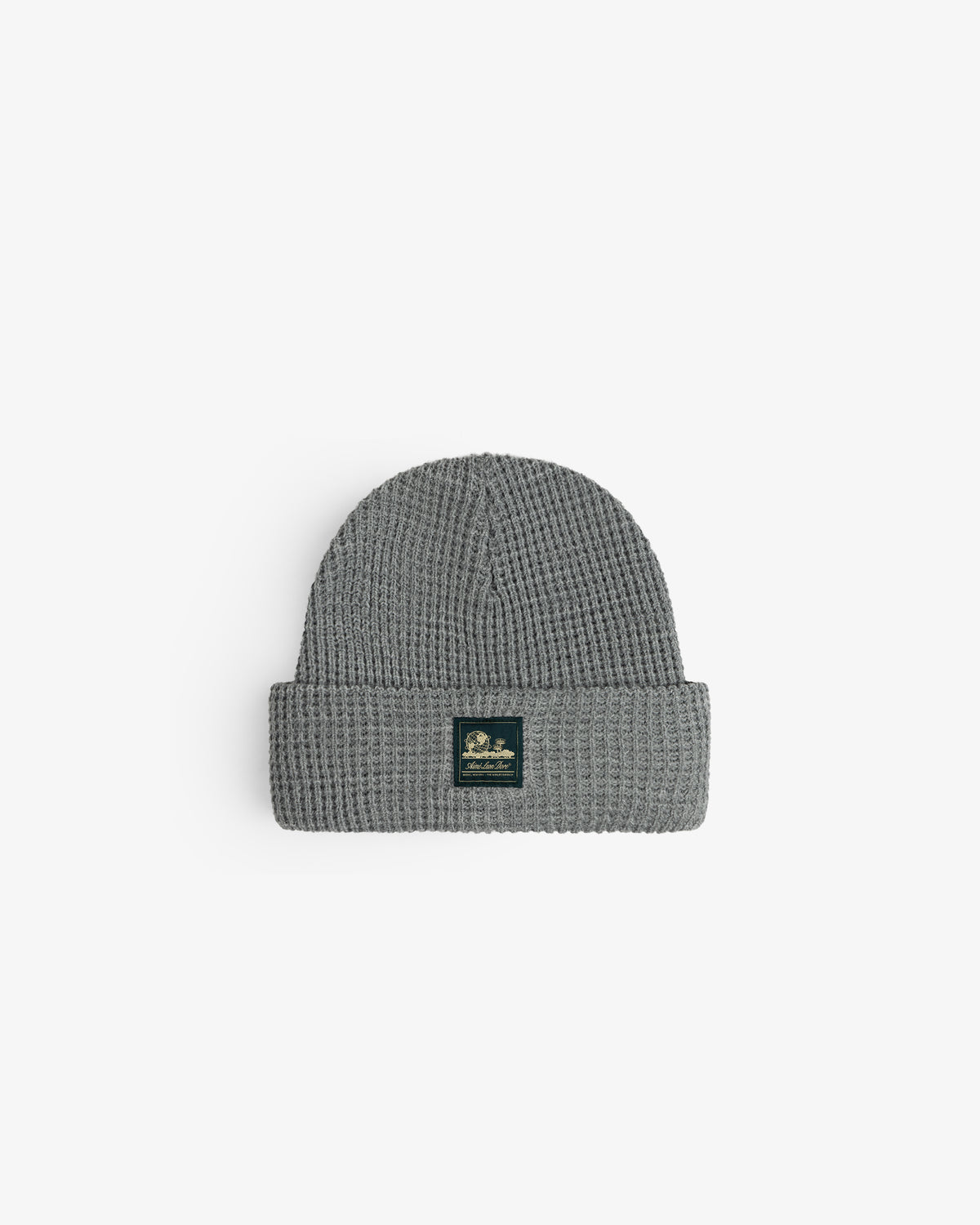 Waffle Knit Beanie in gray with folded brim and black patch, shown on a white background.