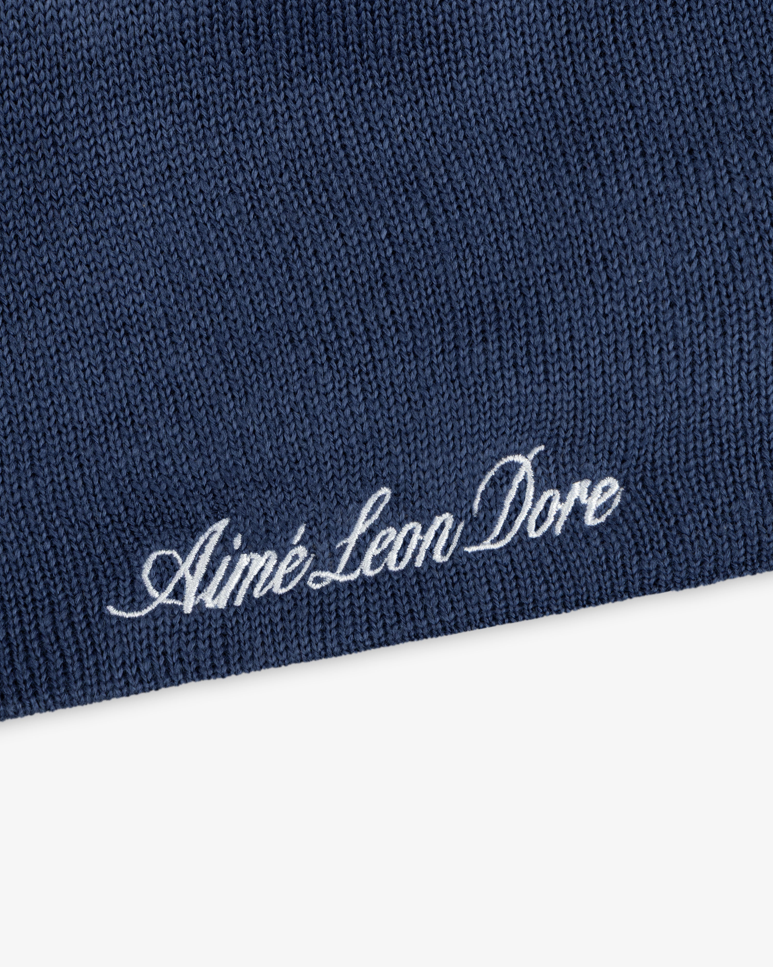 Blue ALD / New Era Dodgers Beanie with white embroidered cursive text.