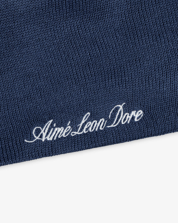 Blue ALD / New Era Dodgers Beanie with white embroidered cursive text.