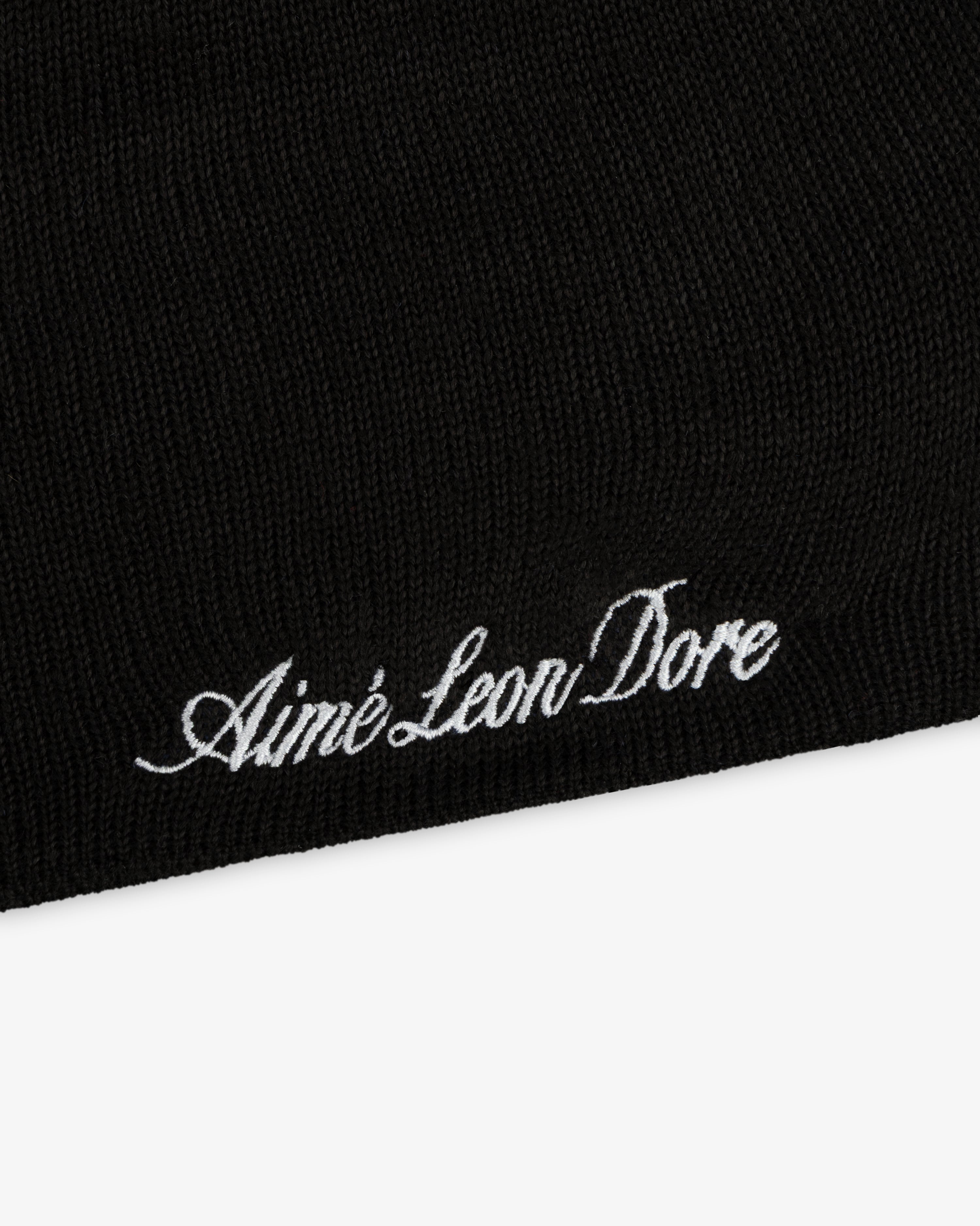 ALD / New Era Mets Beanie, a black knit beanie with white embroidered script text.