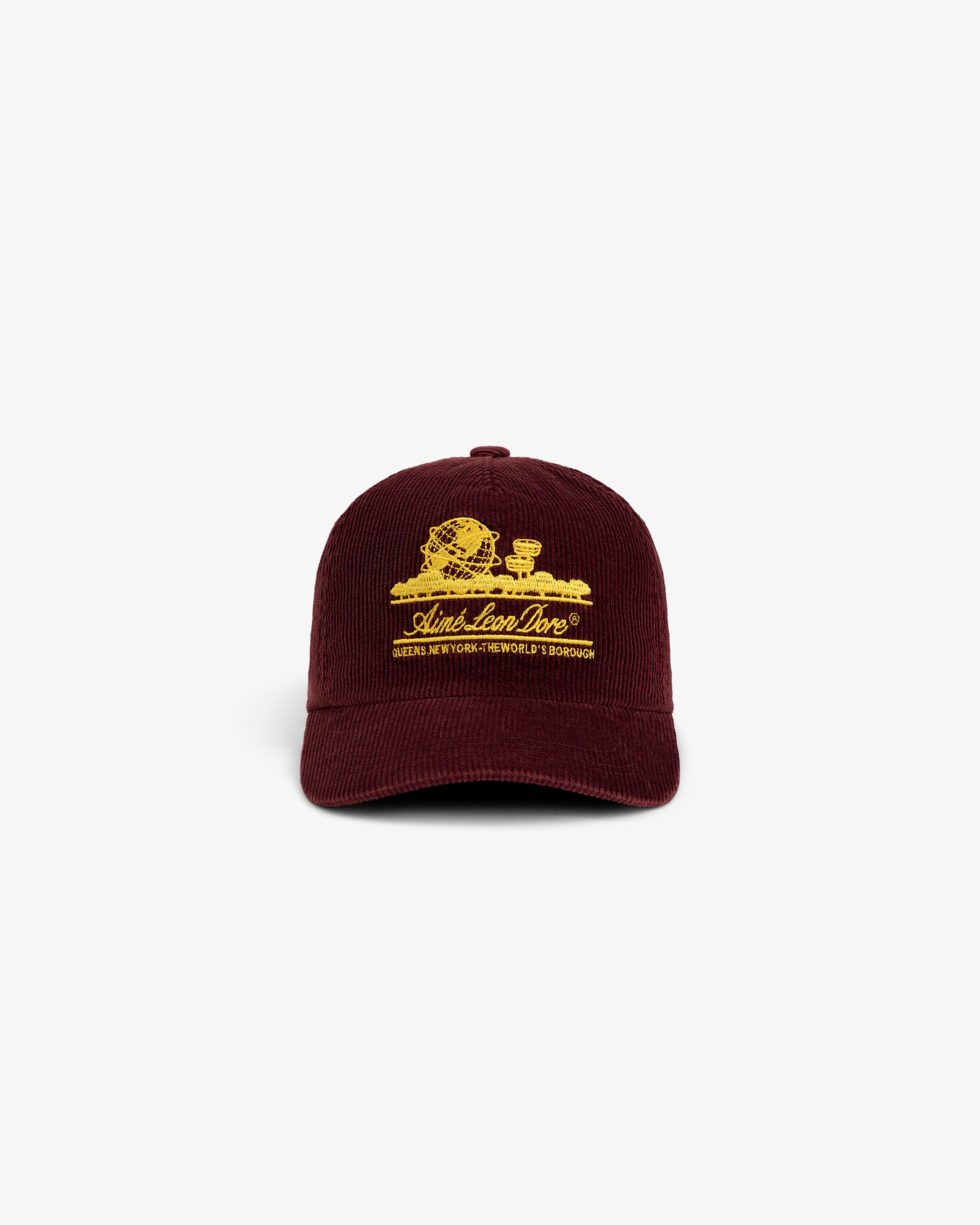Maroon corduroy Corduroy Unisphere Hat with yellow embroidery of the Unisphere and text on the front.