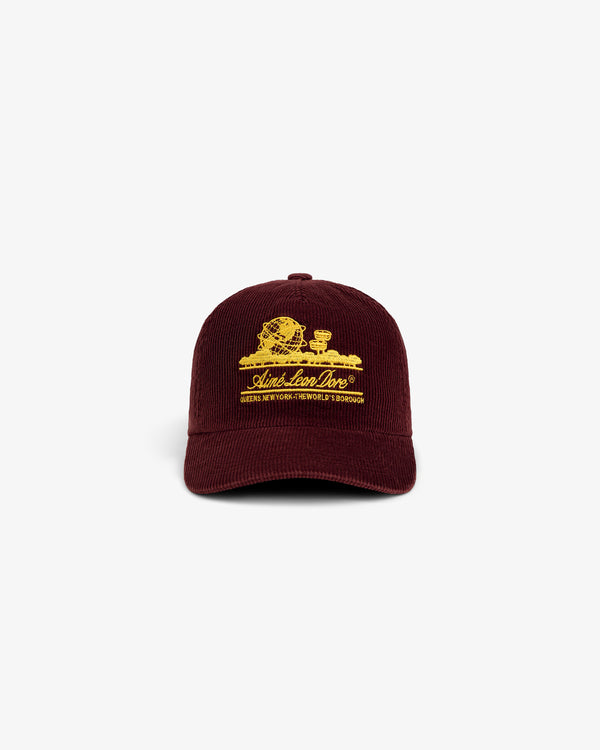 Maroon corduroy Corduroy Unisphere Hat with yellow embroidery of the Unisphere and text on the front.