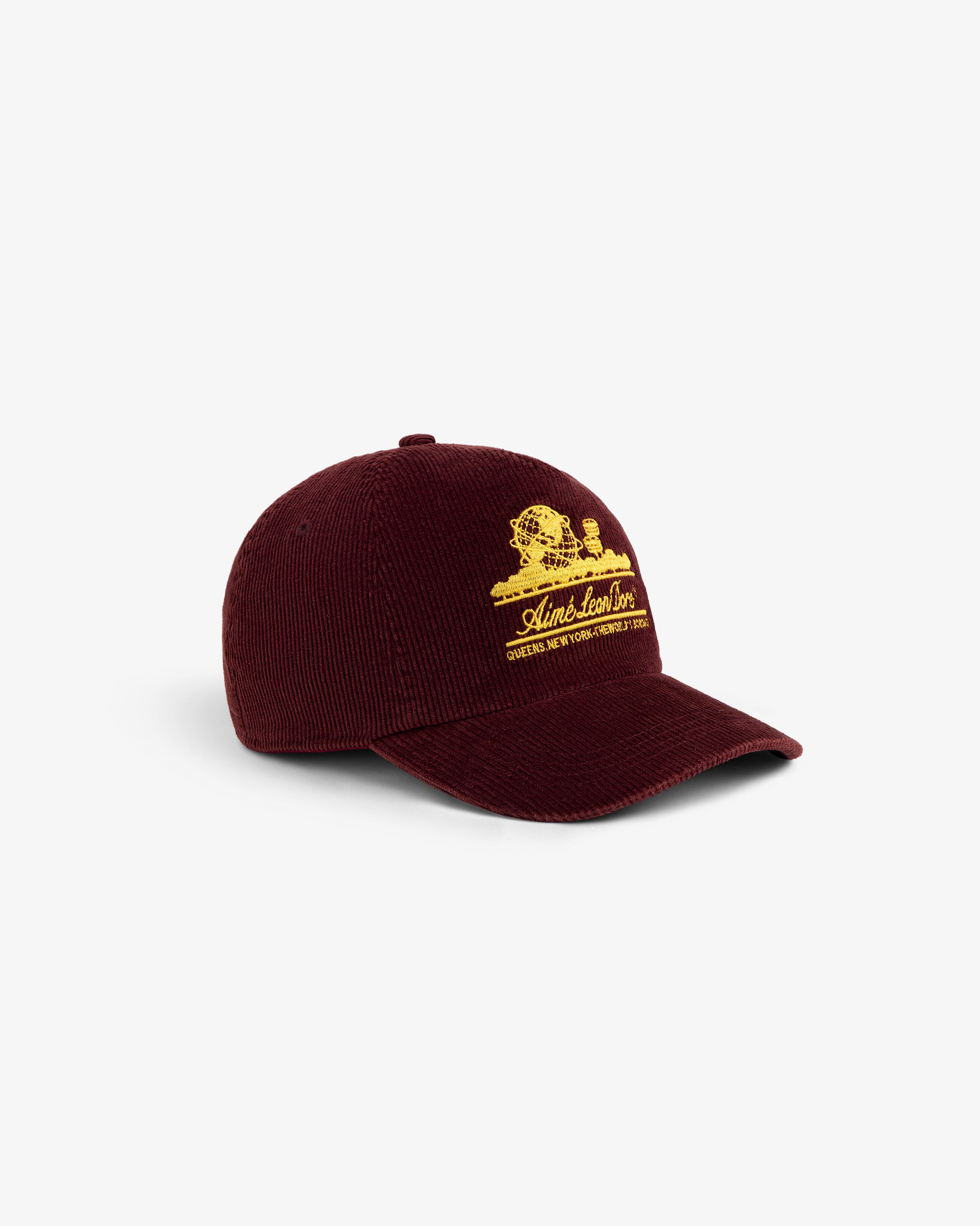 Maroon corduroy Corduroy Unisphere Hat with an embroidered gold globe logo and text.