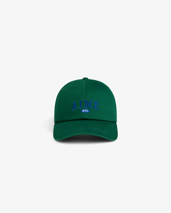 Aimé Souvenir Hat in green with AIMÉ NYC blue embroidery on front, displayed on a plain white background.