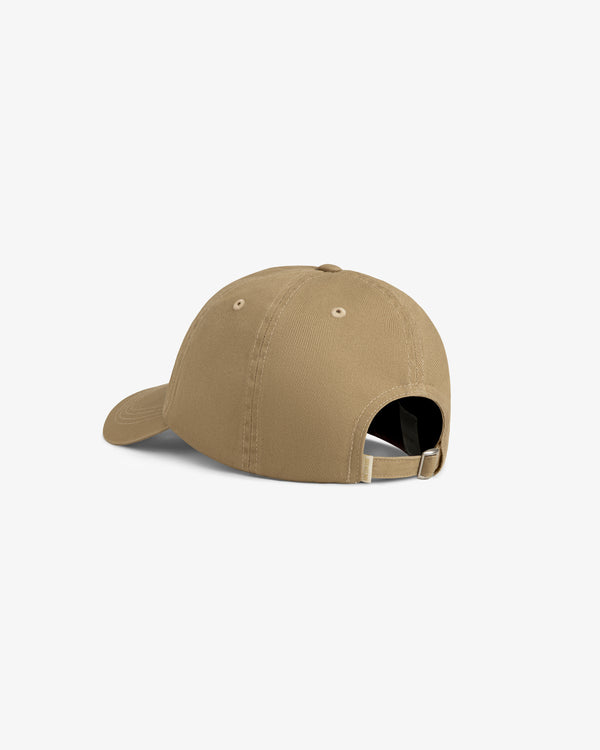 Aimé Souvenir Hat in tan, shown from the back with adjustable buckle strap and curved brim on white background.