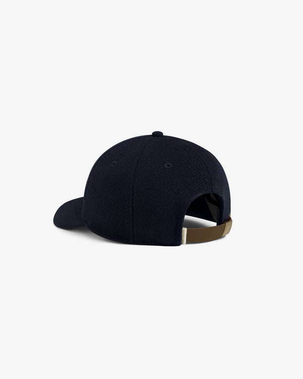 Wool Varsity Logo Hat in navy blue with an adjustable leather back strap.