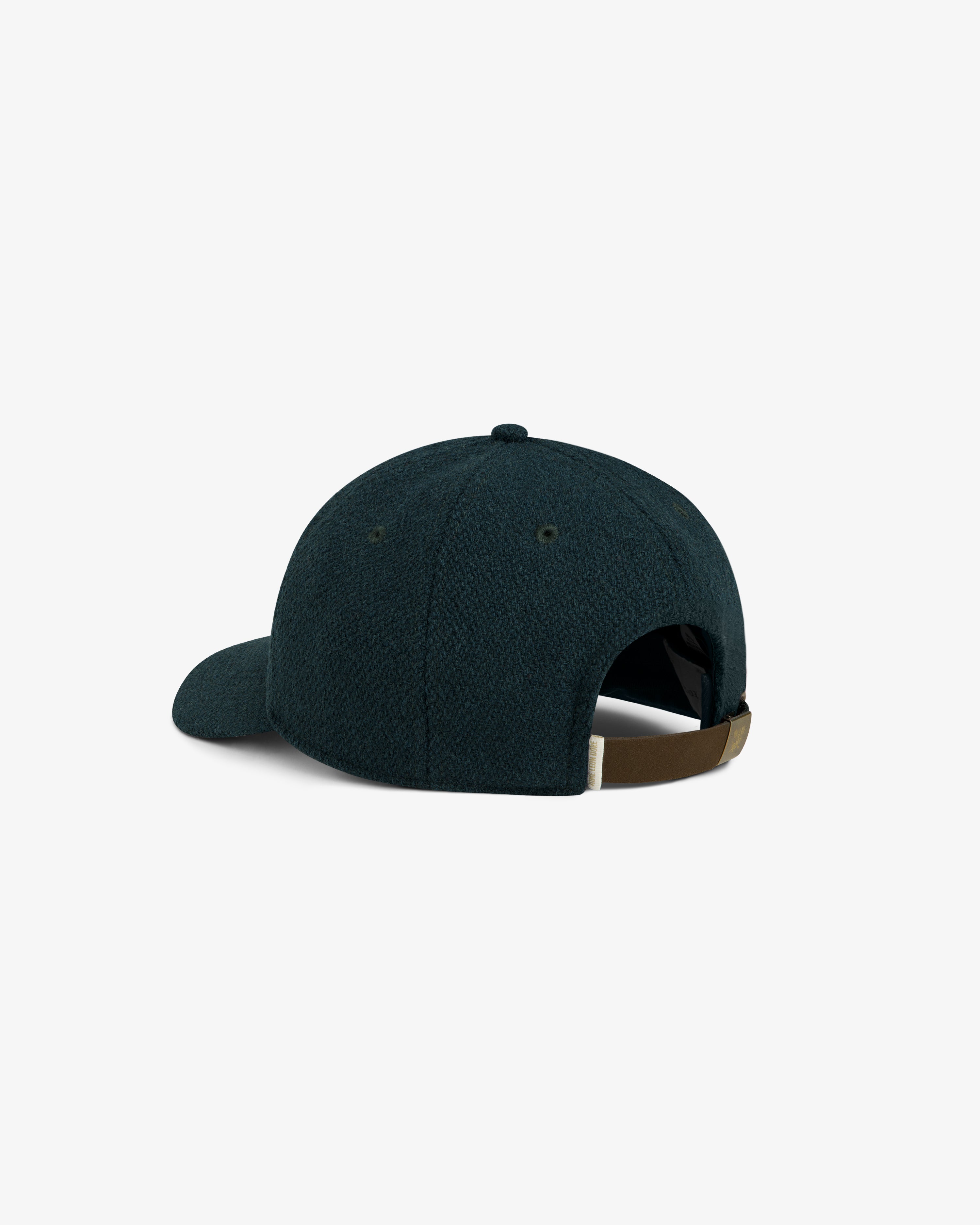 Wool Varsity Logo Hat in dark blue wool with an adjustable brown strap at the back.