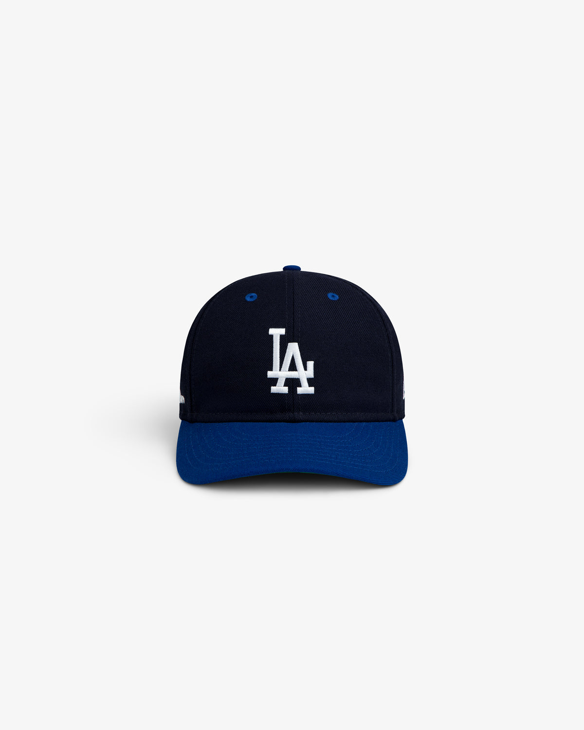ALD / New Era Dodgers Retro Fit Hat, a navy blue baseball cap with a white LA logo and a contrasting blue brim.