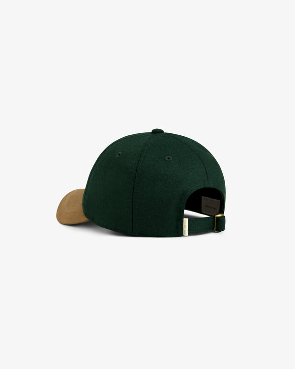 Triborough Chess Club Wool Hat in green with a brown curved brim, back view showing the adjustable strap.