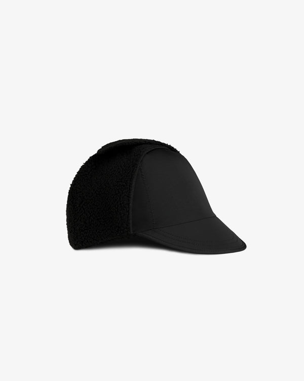 Fleece Lined Earflap Hat in black with a stiff brim and textured earflaps.
