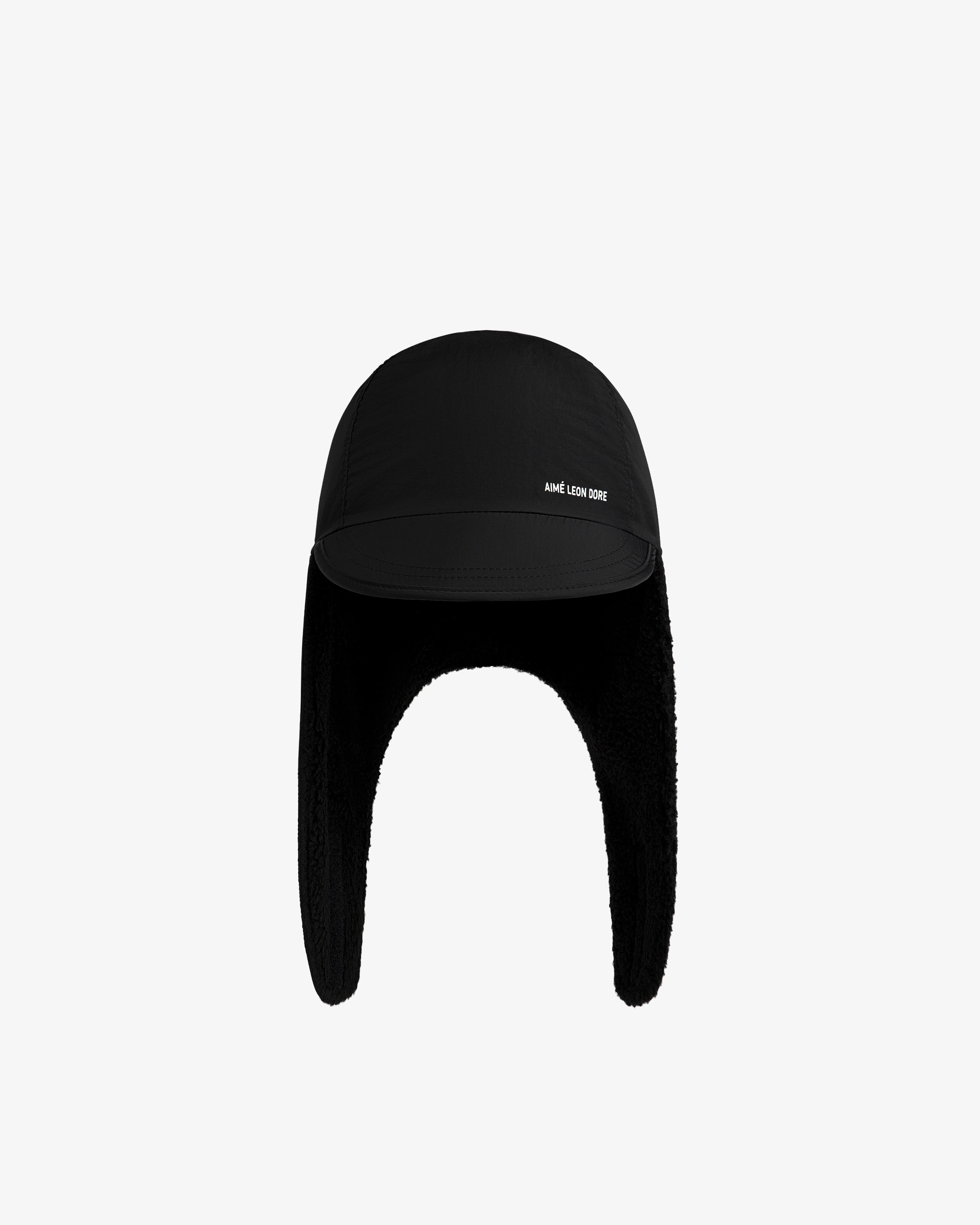 Black Fleece Lined Earflap Hat with fleece lining and white text on the brim.