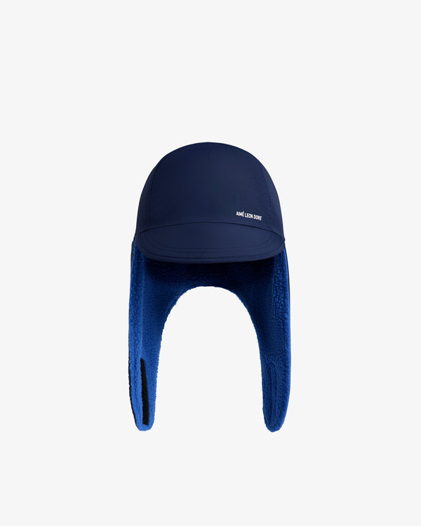 Navy blue Fleece Lined Earflap Hat with earflaps, a fleece lining, and a small white logo on the brim.