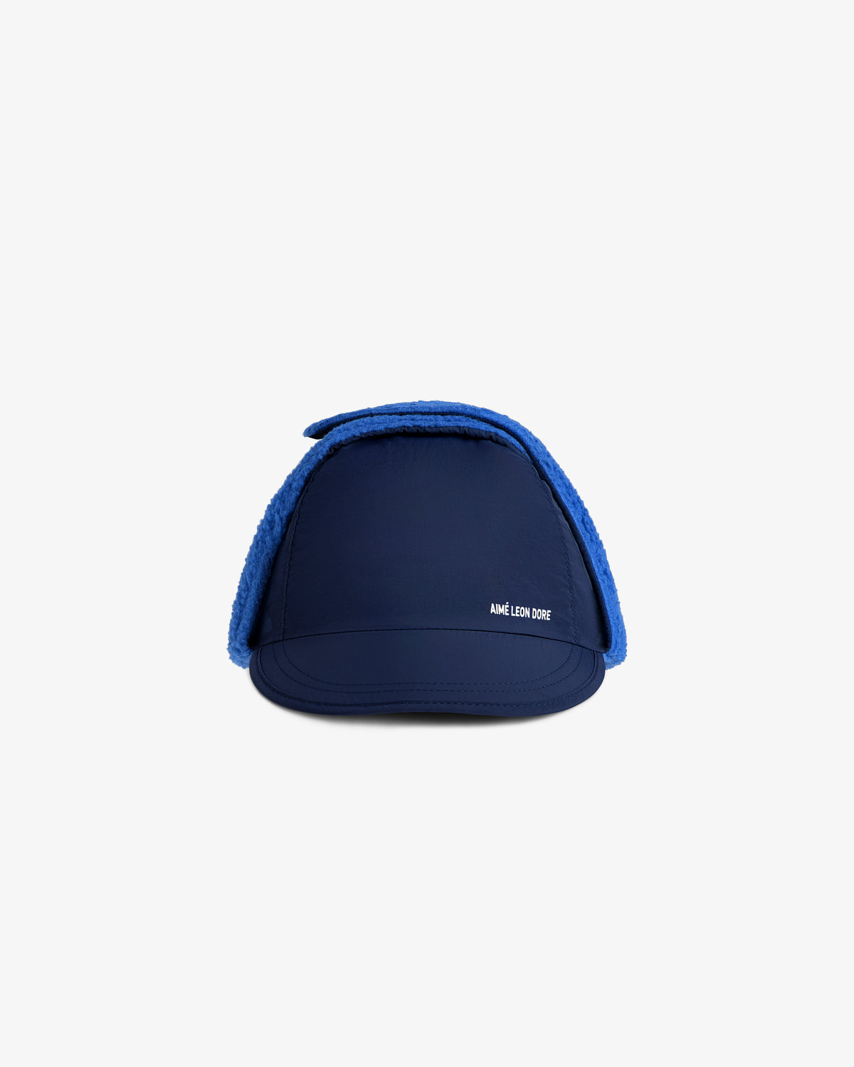 Fleece Lined Earflap Hat in navy blue with bright blue fuzzy earflaps and a small white logo on the front.