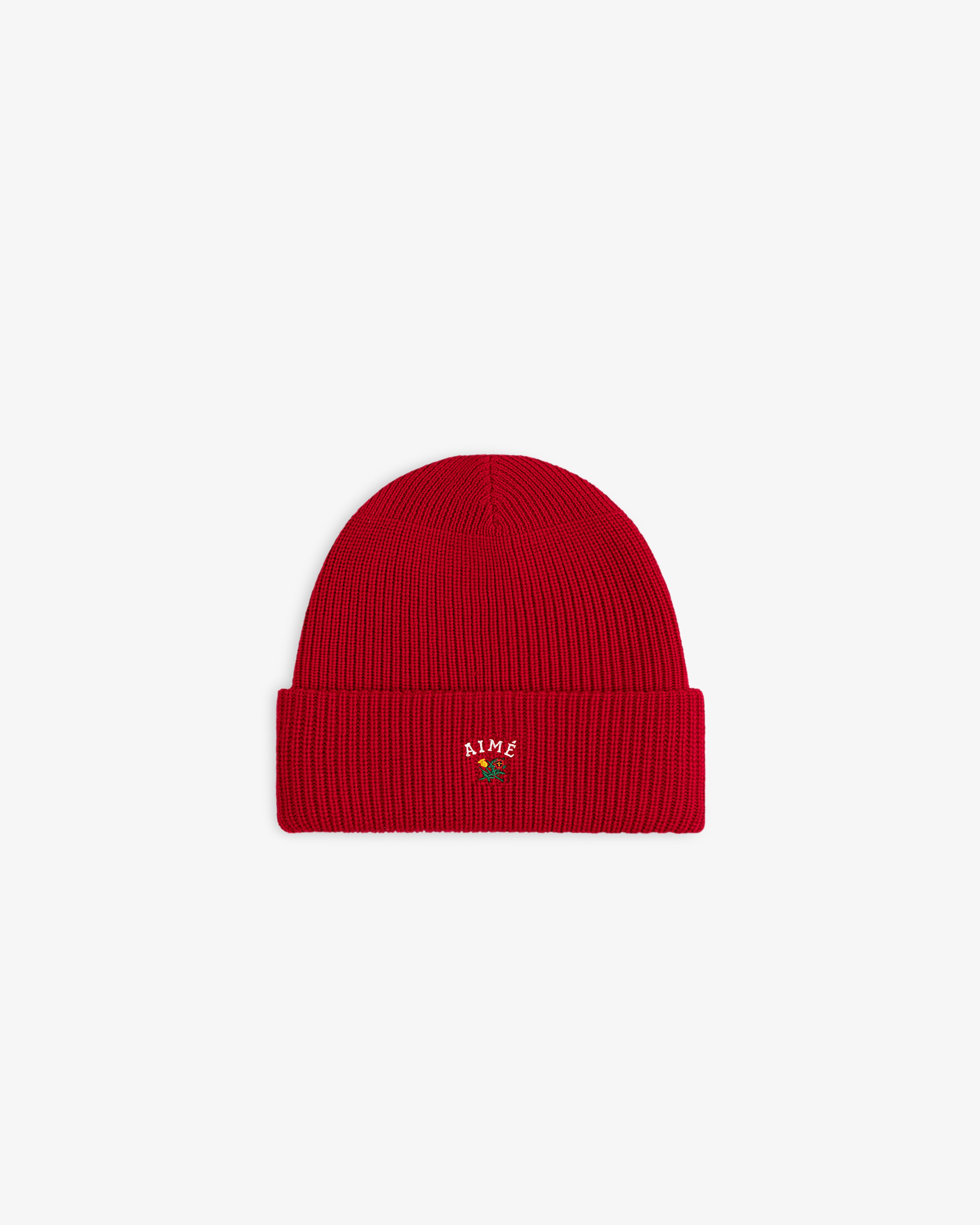 Crest Merino Wool Beanie: bright red, ribbed, folded brim, small AIME embroidery, green plant on front.