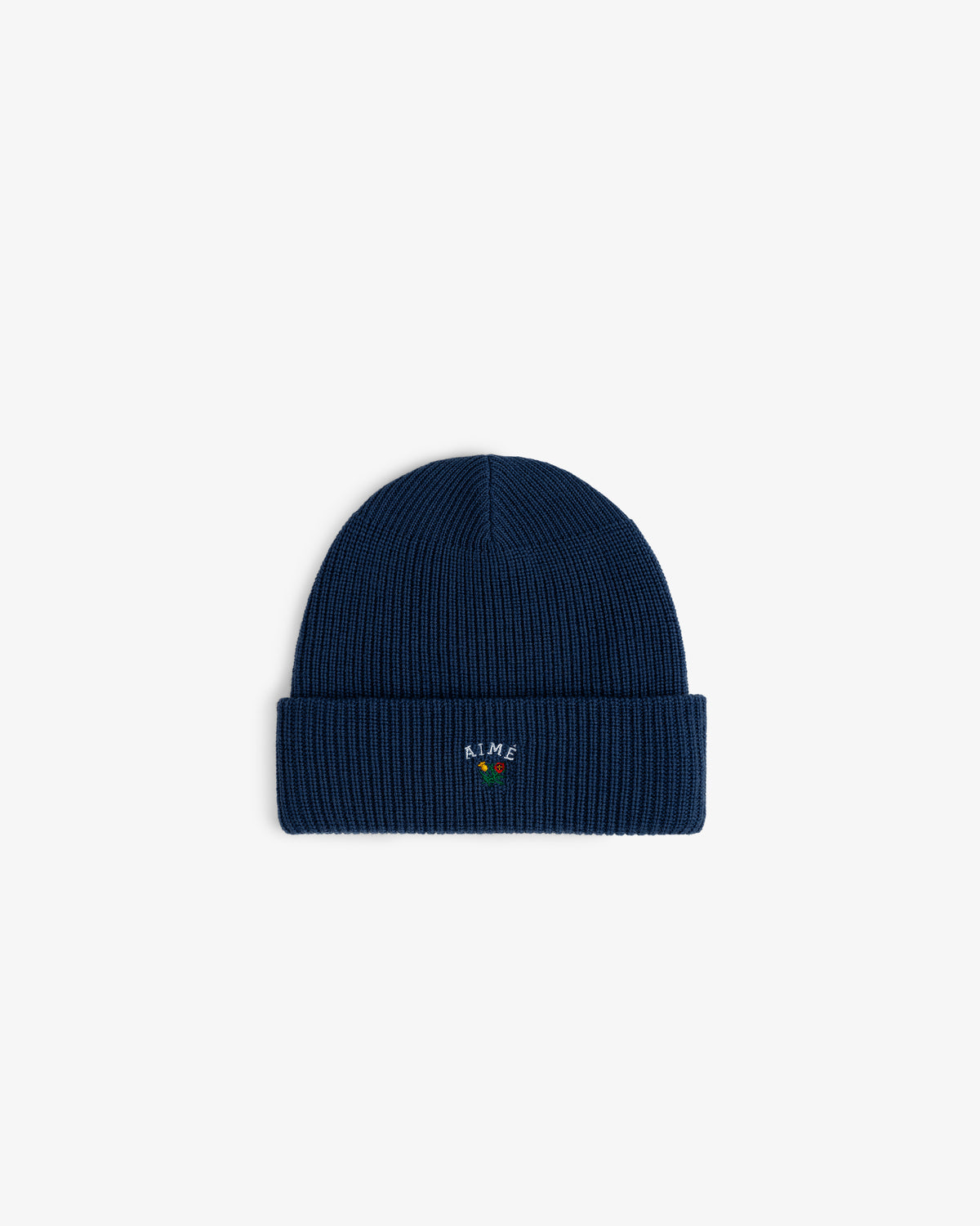 Crest Merino Wool Beanie: navy blue ribbed knit with folded cuff and small colorful embroidered front text.