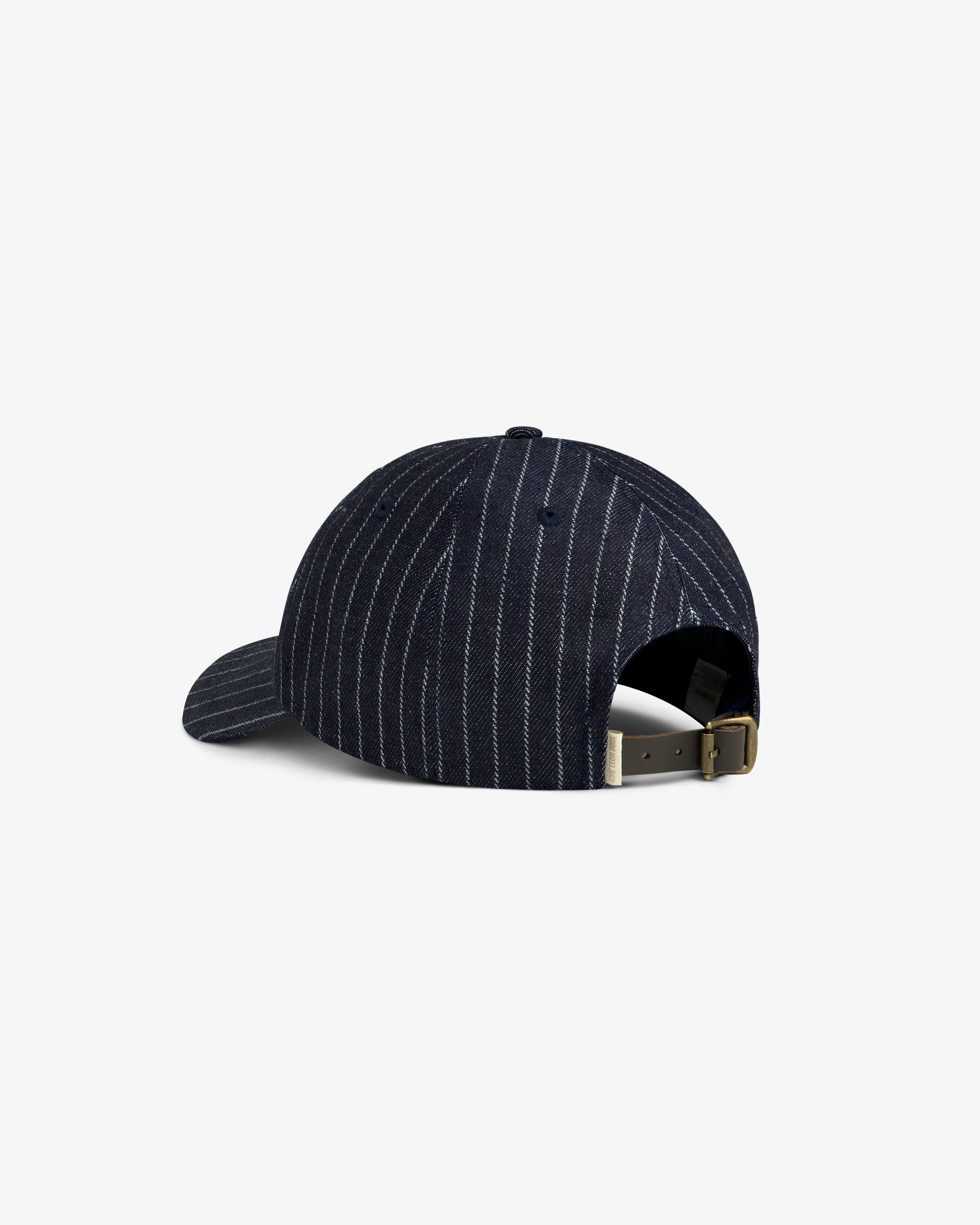 Chalk Stripe Logo Hat in navy with pinstripes, adjustable strap, and brass buckle, shown from the back.