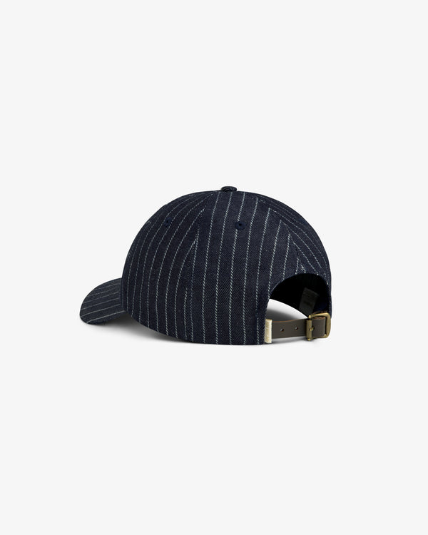 Chalk Stripe Logo Hat in navy with pinstripes, adjustable strap, and brass buckle, shown from the back.