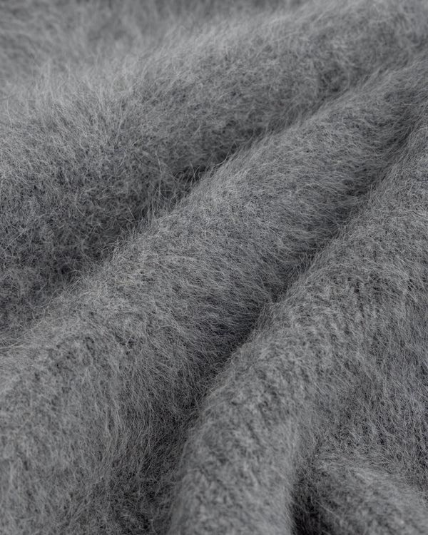 Close-up of a soft, gray, fuzzy Fox Fur Hood with deep folds.