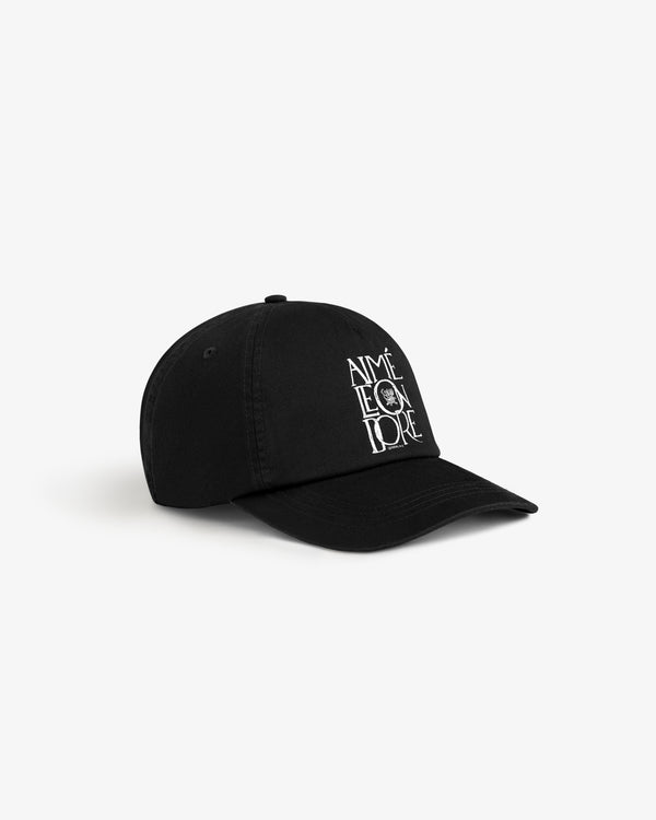 Stacked Logo Hat in black with embroidered AIMÉ LEON DORE text and graphic, shown on a white background.