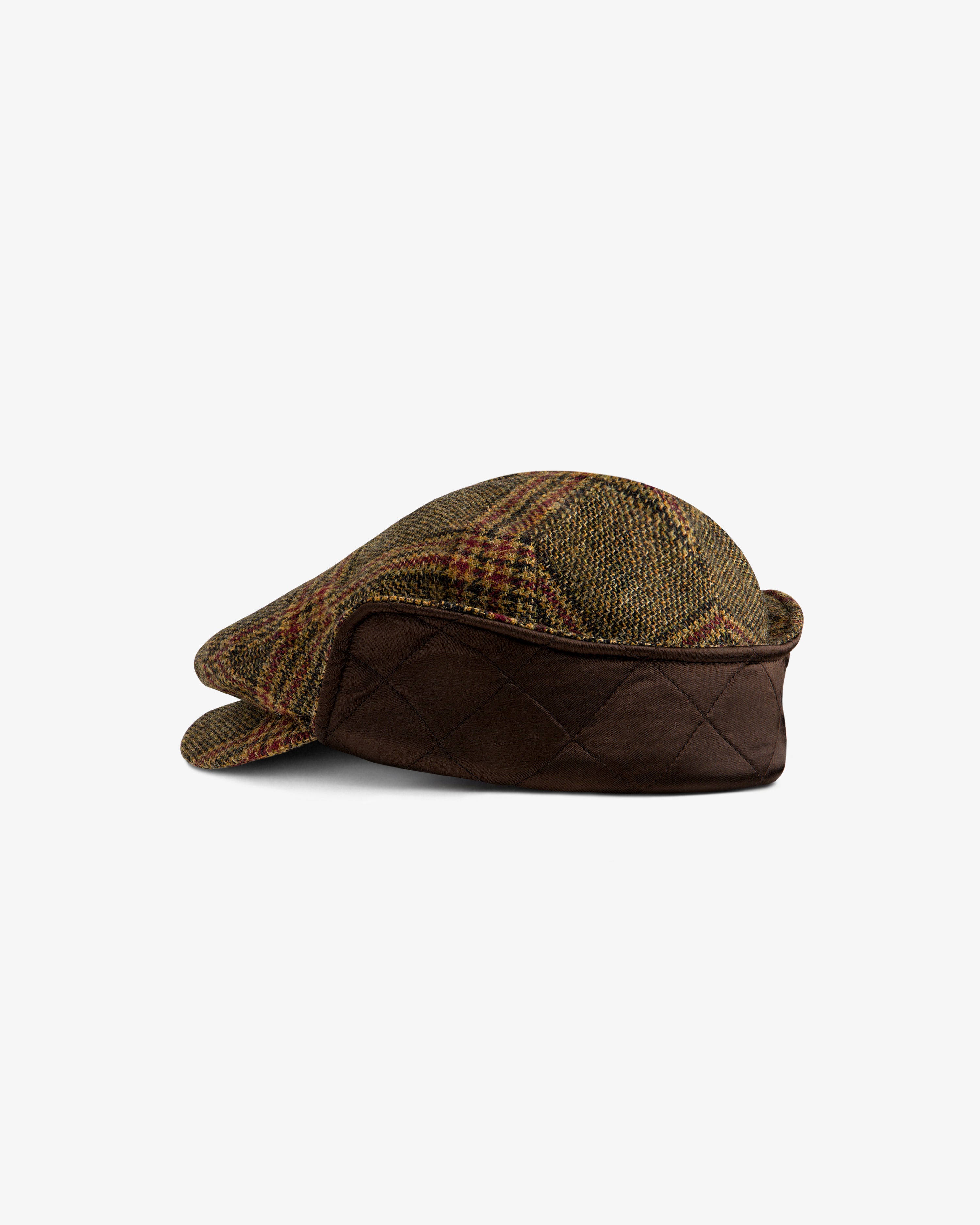 Plaid Tweed Driver’s Hat featuring a plaid tweed fabric and a quilted brown side panel.