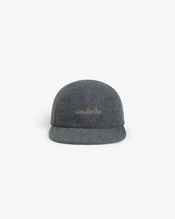 Script Fleece Hat in charcoal grey with cursive gold embroidery on the front.
