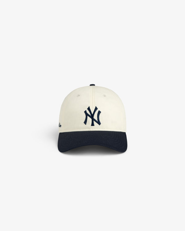 ALD / New Era Yankees Ballpark Hat in cream with a navy brim and NY logo, shown on a white background.