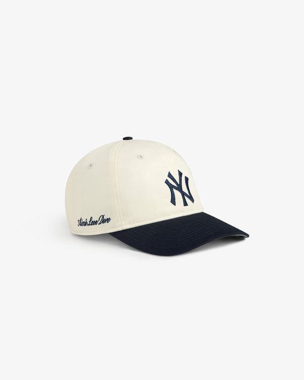 ALD / New Era Yankees Ballpark Hat: Cream cap with navy NY logo/brim, “Starts Love Done” on the side.