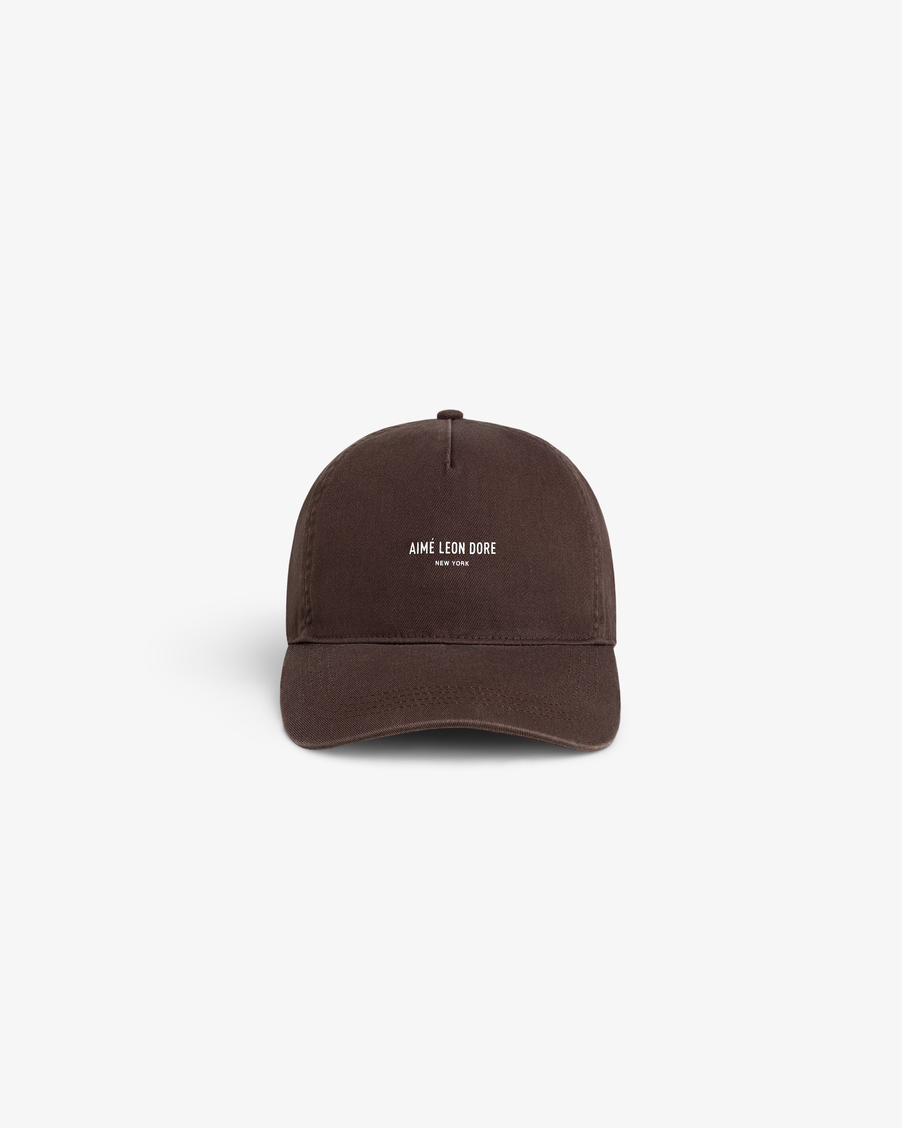 Brown Micro Logo Hat featuring AIMÉ LEON DORE NEW YORK text embroidered in white, centered on the front.