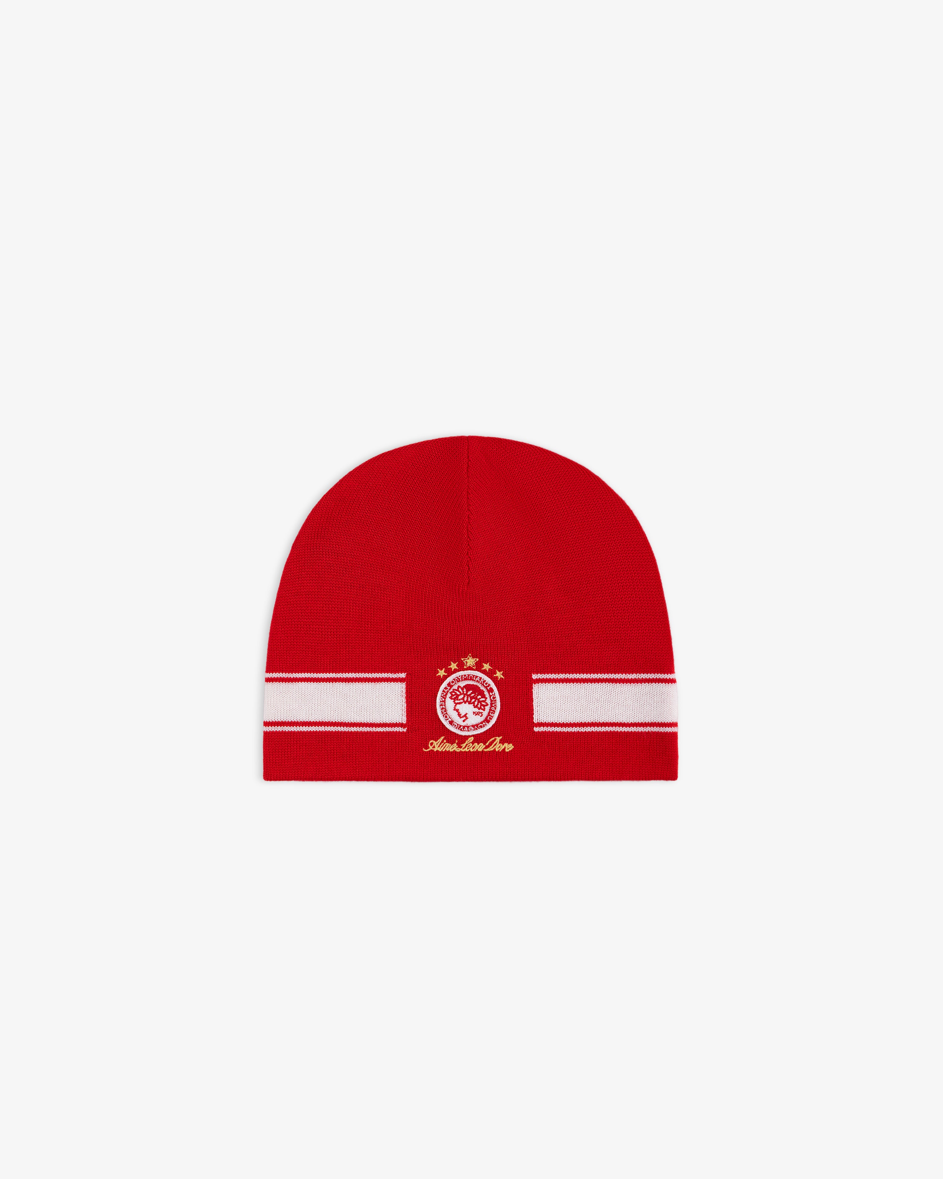 ALD / Olympiacos F.C. Stadium Beanie, a red beanie with a white horizontal stripe and a circular team crest in gold.