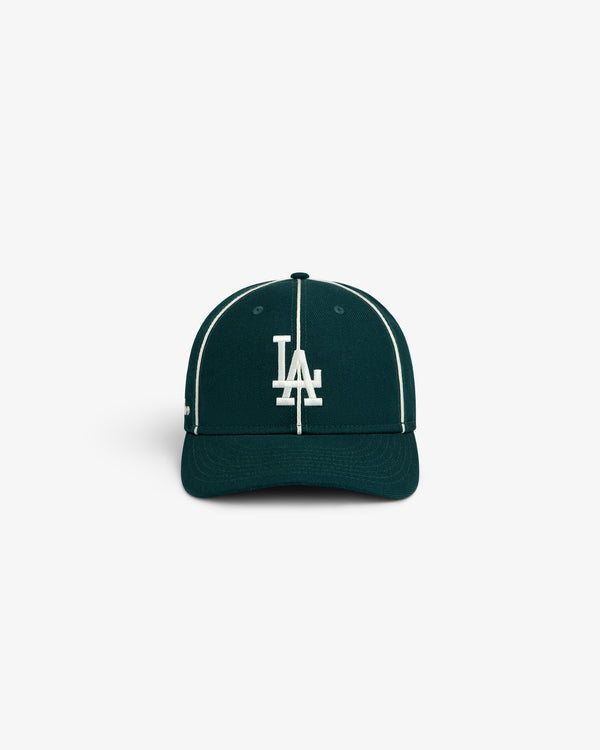 ALD / New Era Dodgers Wool Hat in dark green with a white LA logo and white piping along the crown seams.
