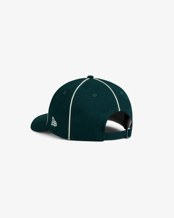 ALD / New Era Dodgers Wool Hat in dark green with white piping along the seams and an adjustable back strap.