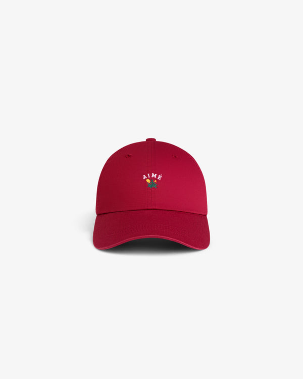 Crest Logo Hat in red with AIME and small flower embroidery on front, shown against a white background.