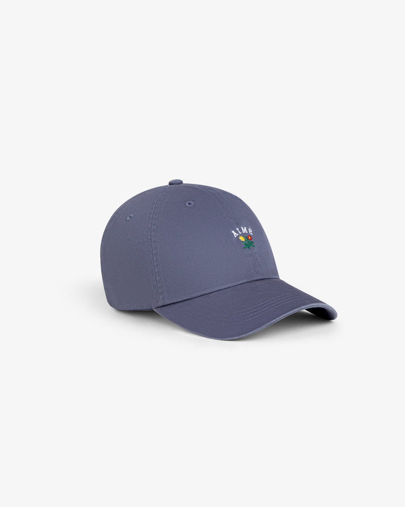 Crest Logo Hat in blue with small floral embroidery and “ALIVE” text, displayed on a white background.
