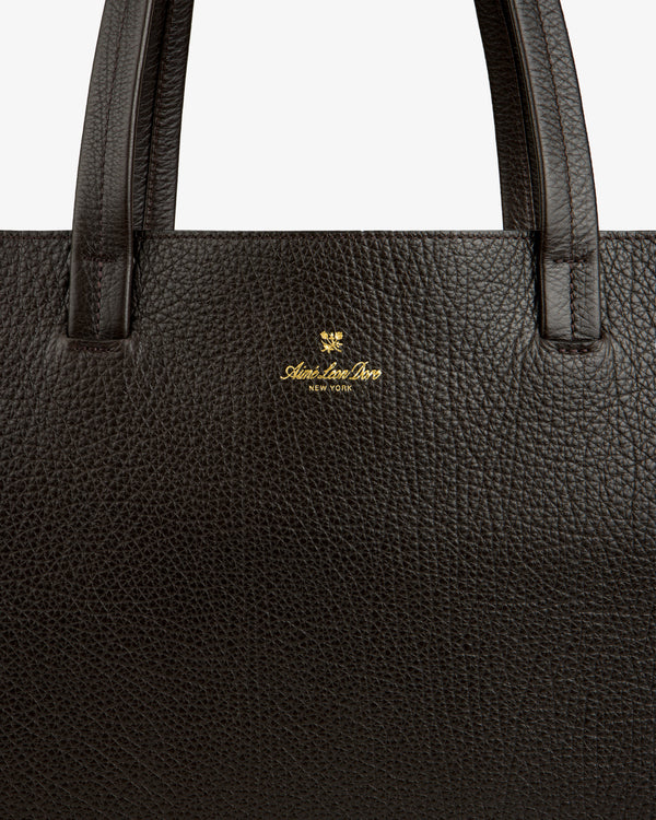 Close-up of a Tumbled Leather Tote Bag in dark brown with gold Adam Lee Bros. New York logo under the handle.