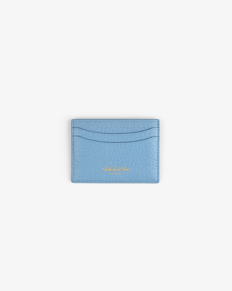 Tumbled Leather Card Holder in light blue with two slots and gold text, shown on a white background.