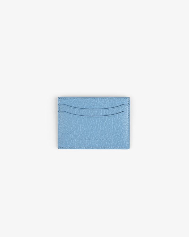 Tumbled Leather Card Holder in light blue leather with two slots, displayed on a plain white background.