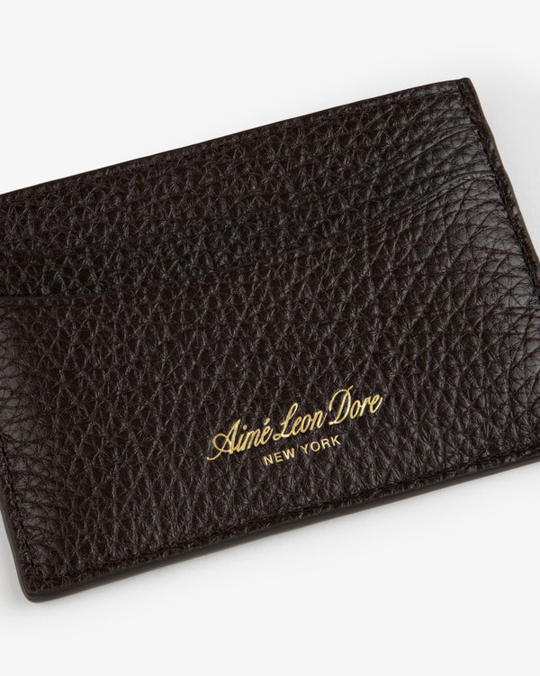 Tumbled Leather Card Holder in dark brown, gold Aimé Leon Dore NEW YORK embossing on textured leather front.
