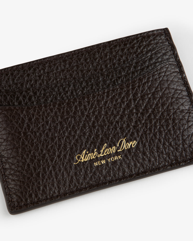 Tumbled Leather Card Holder in dark brown, gold Aimé Leon Dore NEW YORK embossing on textured leather front.