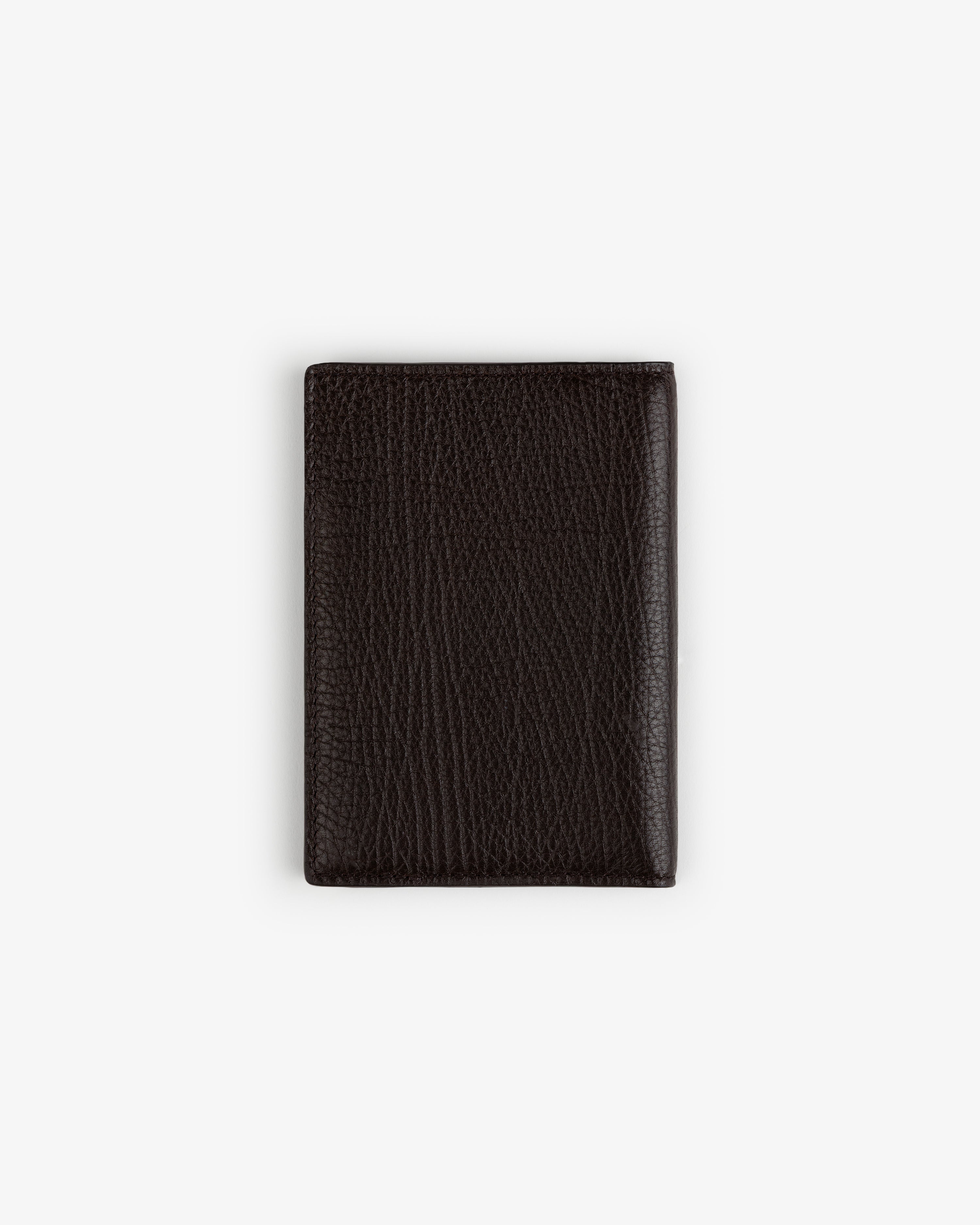 Tumbled Leather Passport Holder in dark brown, pebbled finish, shown closed on a plain white background.