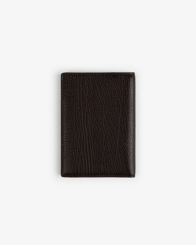 Tumbled Leather Passport Holder in dark brown, pebbled finish, shown closed on a plain white background.