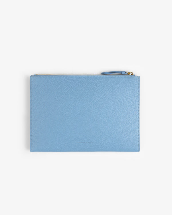 Small Tumbled Leather Pouch in light blue, rectangular with a top zipper, displayed on a white background.