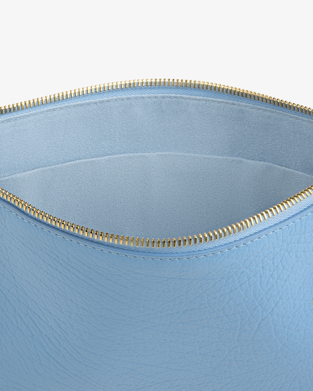 Small Tumbled Leather Pouch in light blue leather with gold zipper, open to show soft empty interior on white background.