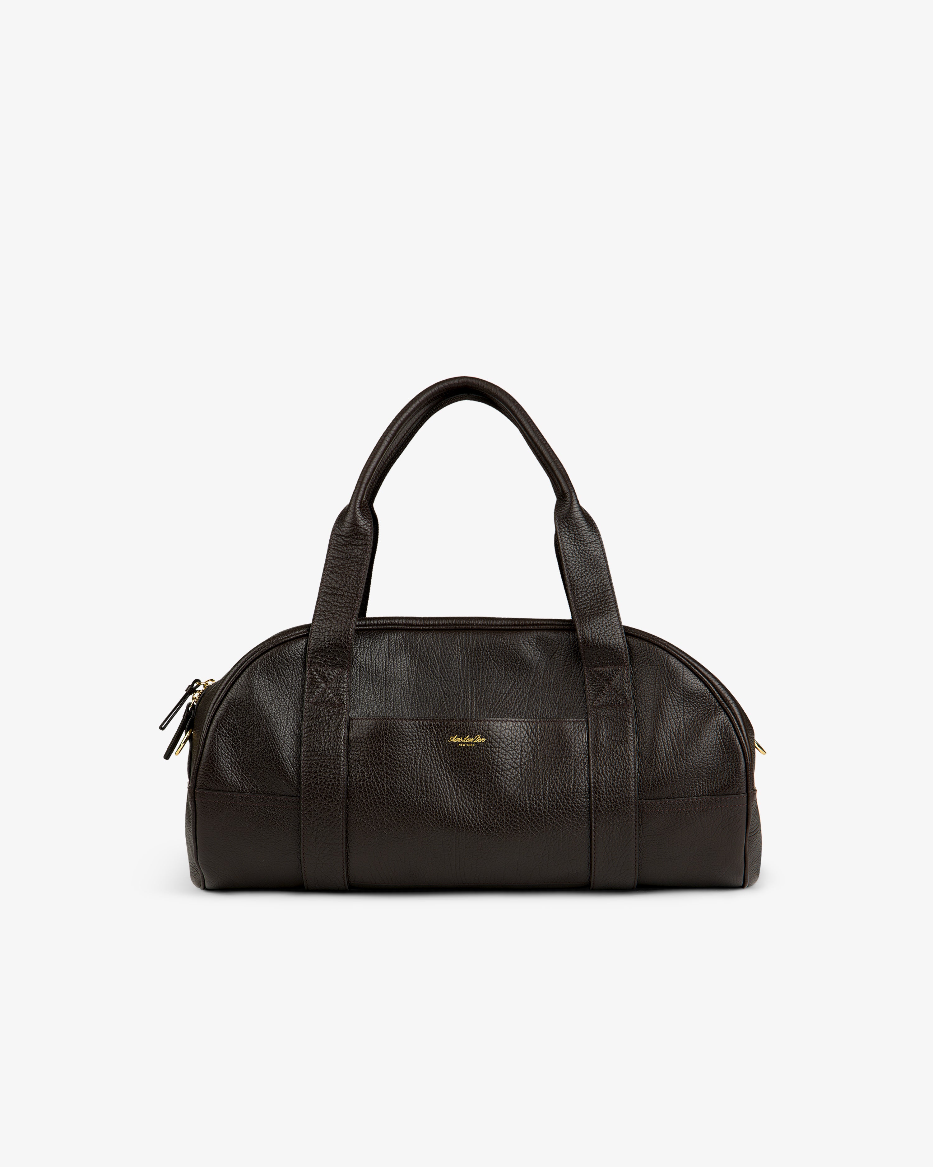Tumbled Leather Duffle in dark brown with two handles, gold zipper, and a small gold logo on the front.