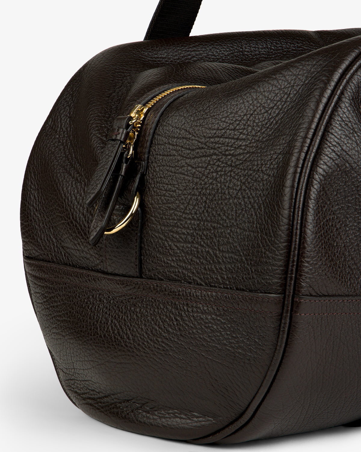 Close-up of the Tumbled Leather Duffle in textured dark brown leather with zip and gold hardware.