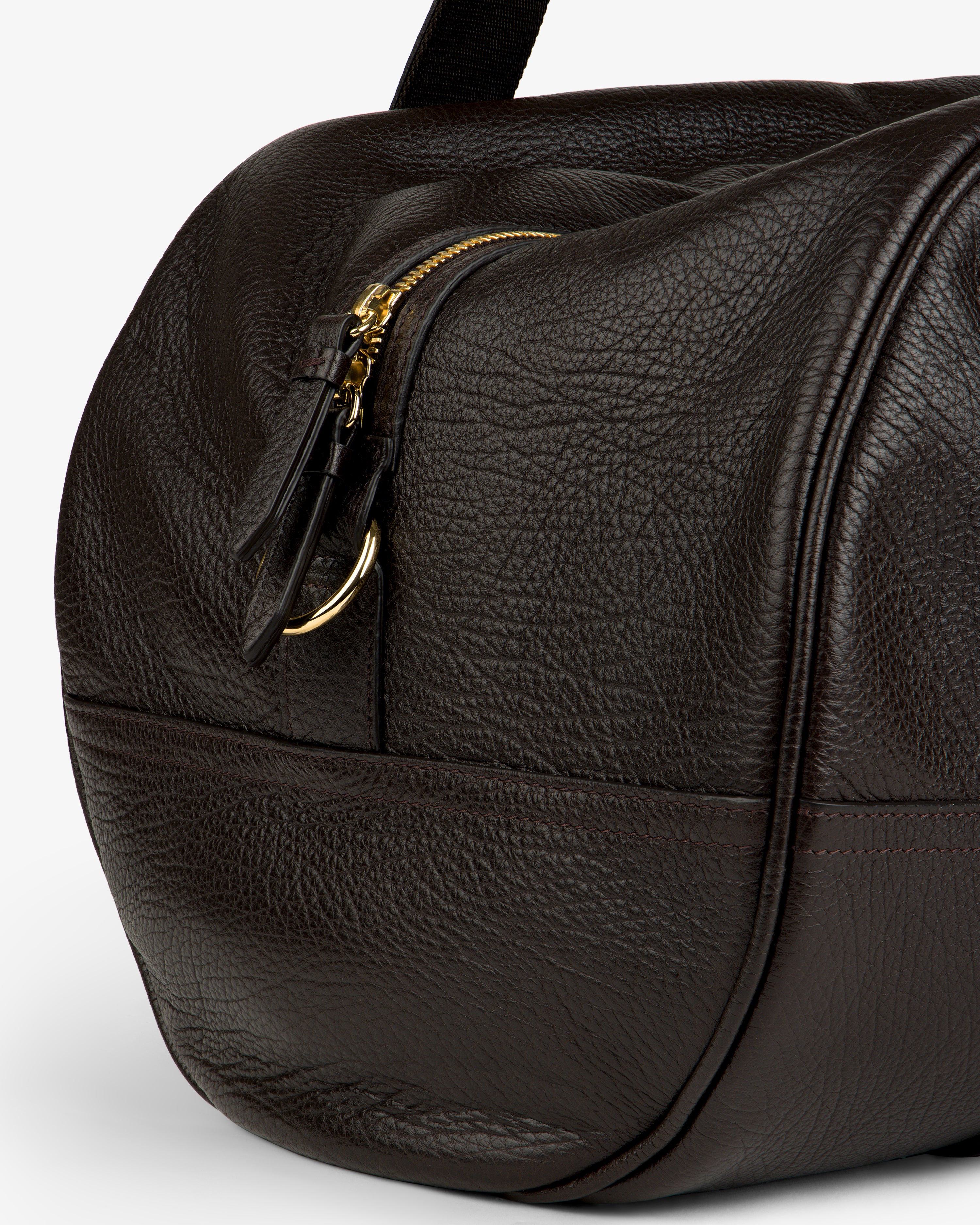 Close-up of the Tumbled Leather Duffle in textured dark brown leather with zip and gold hardware.